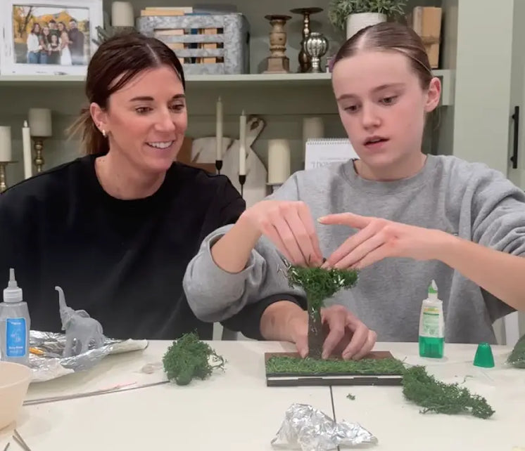 Parent and child building a Vigdee kids craft kit together